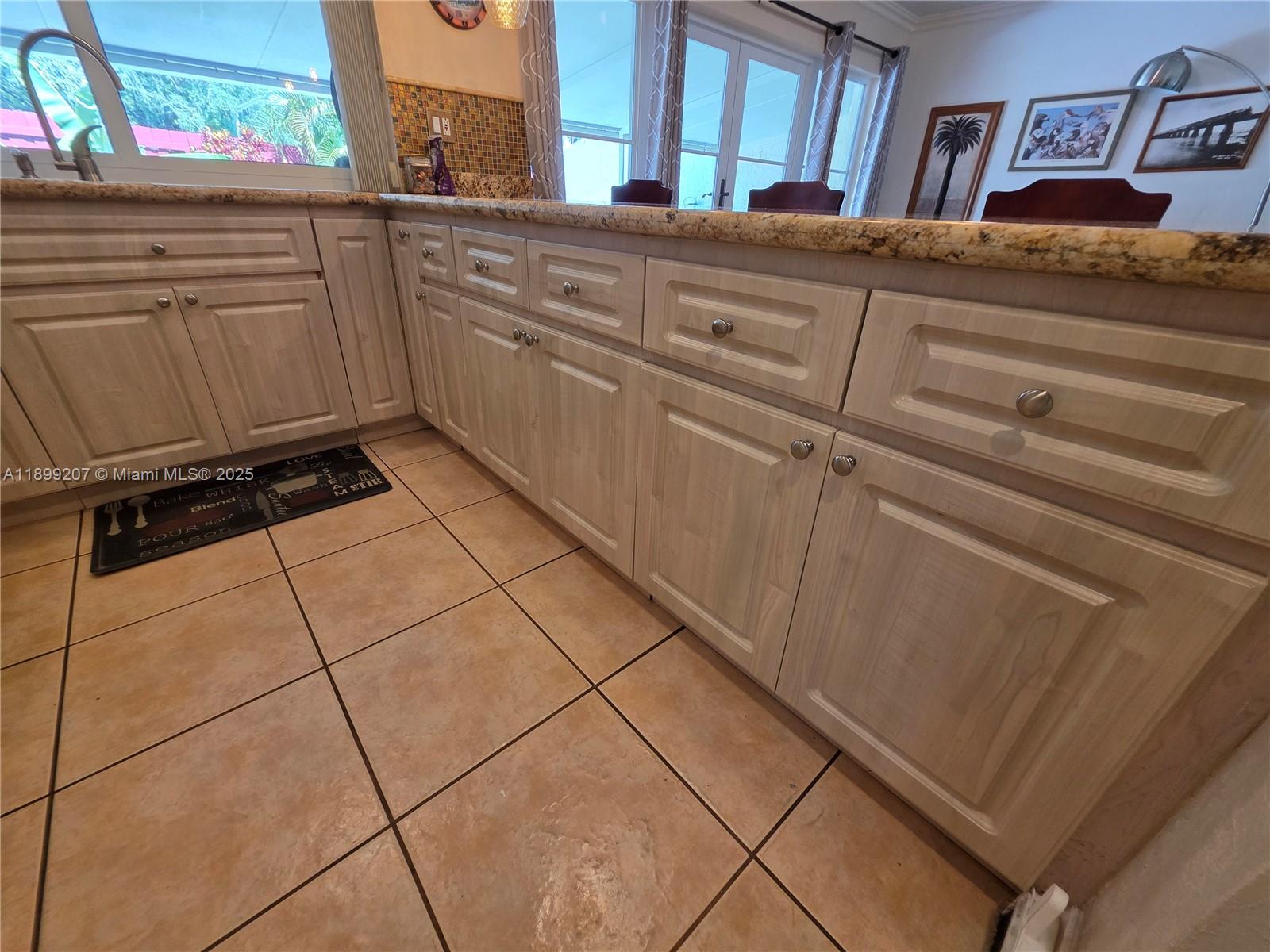 6923 Holly Road Miami Lakes, FL 33014 - Photo 6 of 23 a kitchen with a sink and cabinets