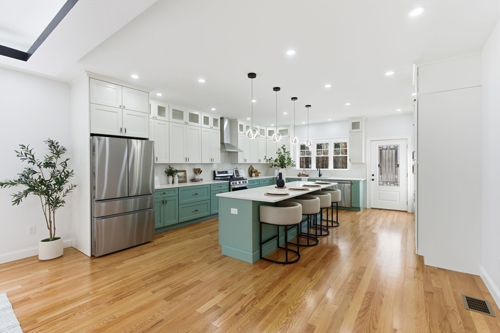 251 Clark Road Lowell, MA 01852 - Photo 11 of 36 a kitchen with a sink appliances and cabinets