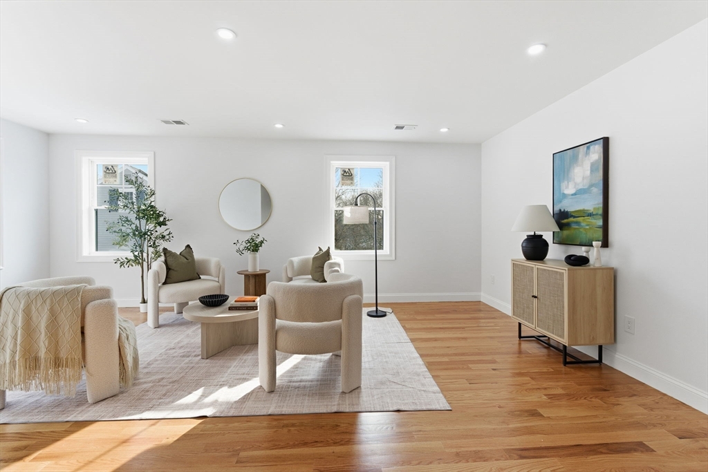 251 Clark Road Lowell, MA 01852 - Photo 20 of 36 a living room with furniture and a large window