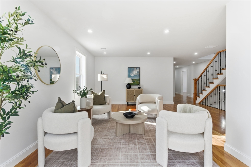 251 Clark Road Lowell, MA 01852 - Photo 21 of 36 a living room with furniture and a potted plant