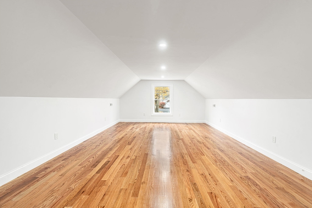 251 Clark Road Lowell, MA 01852 - Photo 22 of 36 an empty room with wooden floor and windows