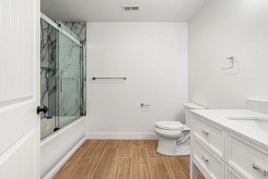 251 Clark Road Lowell, MA 01852 - Photo 24 of 36 a bathroom with a sink a toilet and shower