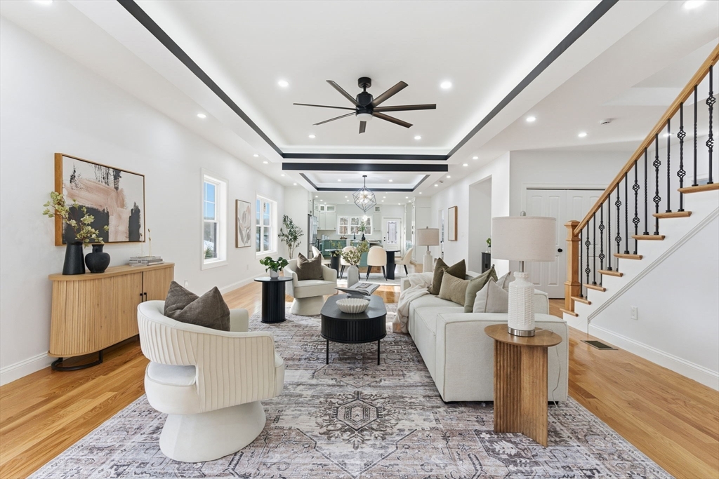 251 Clark Road Lowell, MA 01852 - Photo 3 of 36 a living room with fireplace furniture and a chandelier