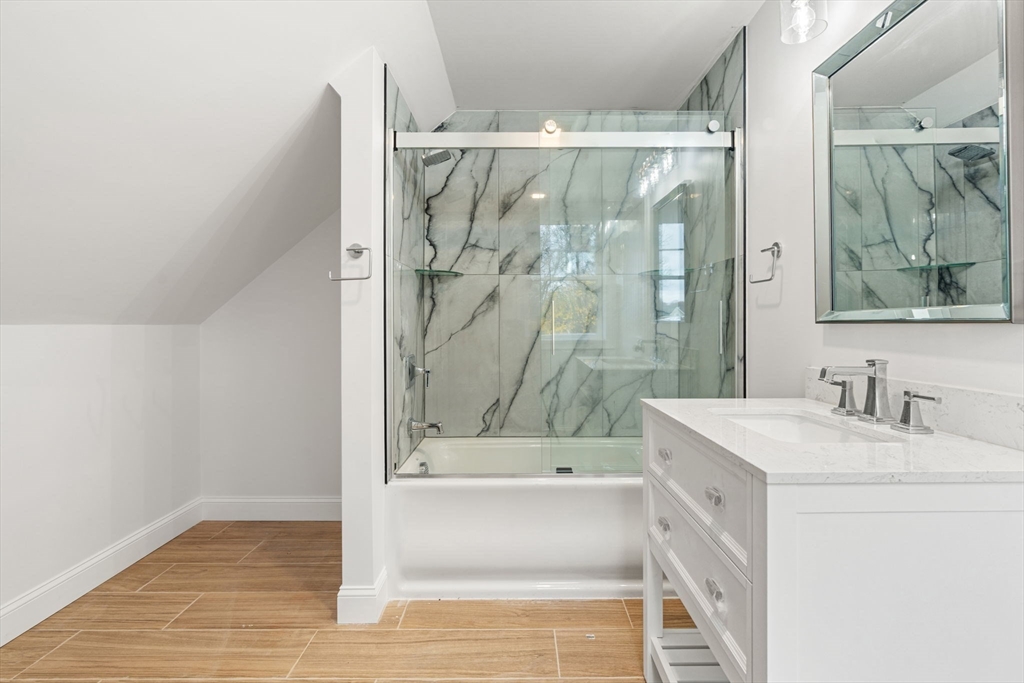 251 Clark Road Lowell, MA 01852 - Photo 31 of 36 a bathroom with a bathtub and a shower