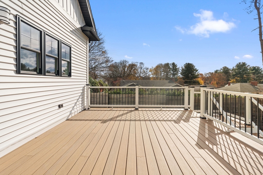 251 Clark Road Lowell, MA 01852 - Photo 35 of 36 a view of balcony with wooden floor and fence