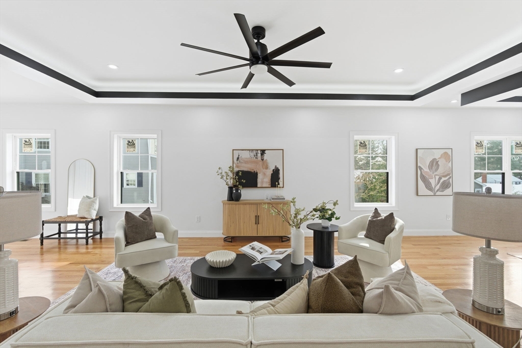 251 Clark Road Lowell, MA 01852 - Photo 5 of 36 a living room with furniture and a wooden floor