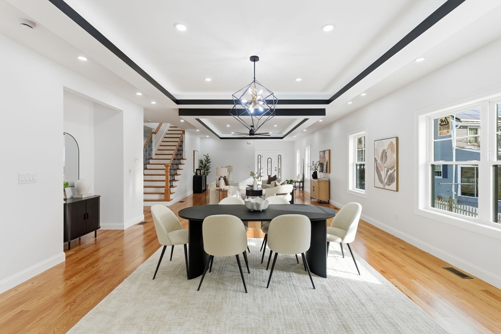 251 Clark Road Lowell, MA 01852 - Photo 10 of 36 a view of a dining room with furniture window and wooden floor
