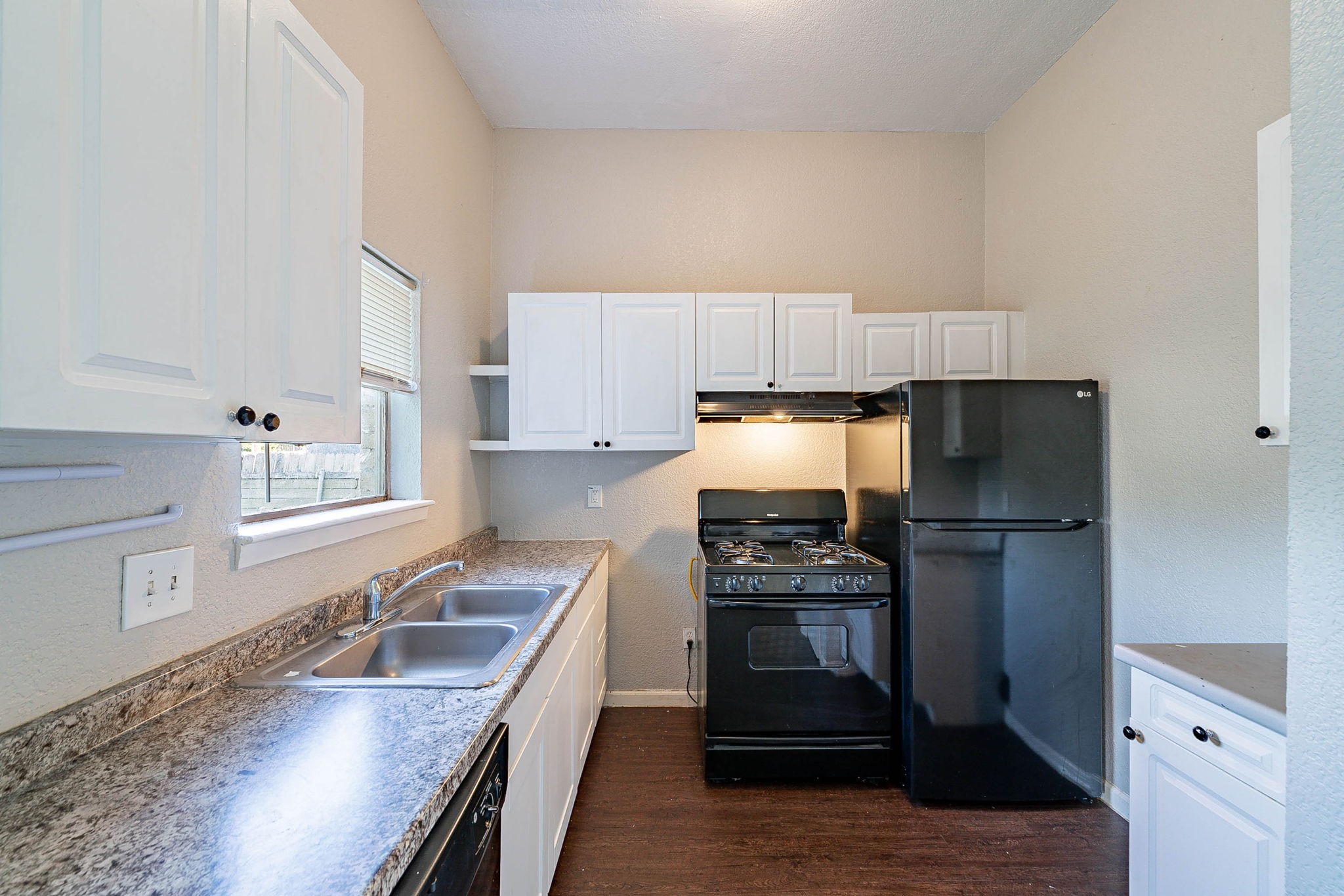 1502 Stevenage Lane Channelview, TX 77530 - Photo 11 of 33 a kitchen with a sink stove and refrigerator