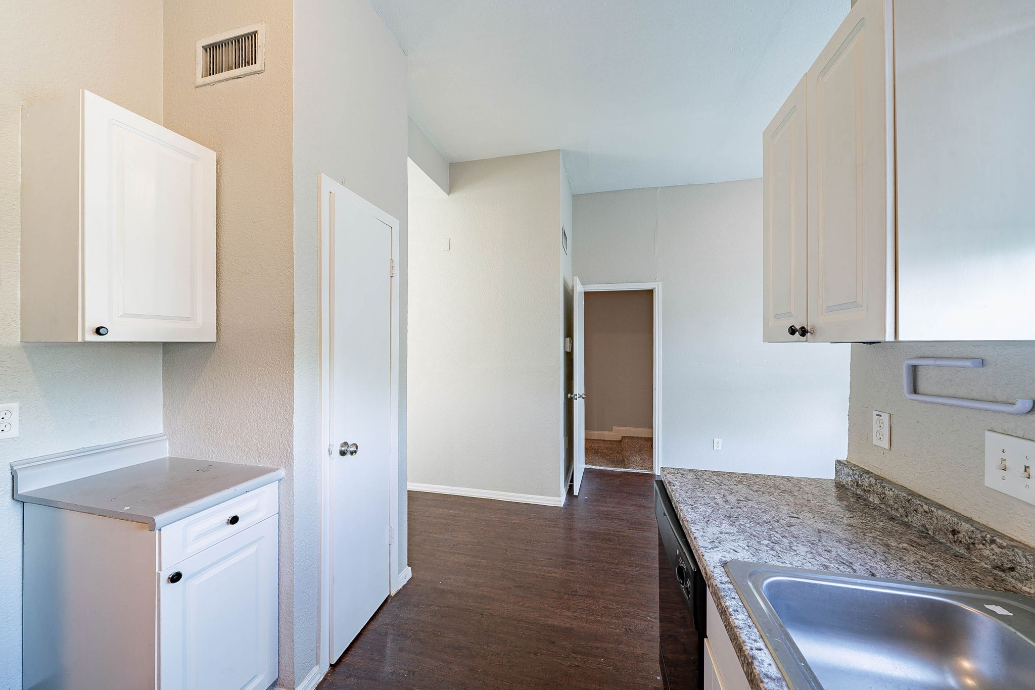 1502 Stevenage Lane Channelview, TX 77530 - Photo 13 of 33 a kitchen with stainless steel appliances granite countertop a sink and cabinets
