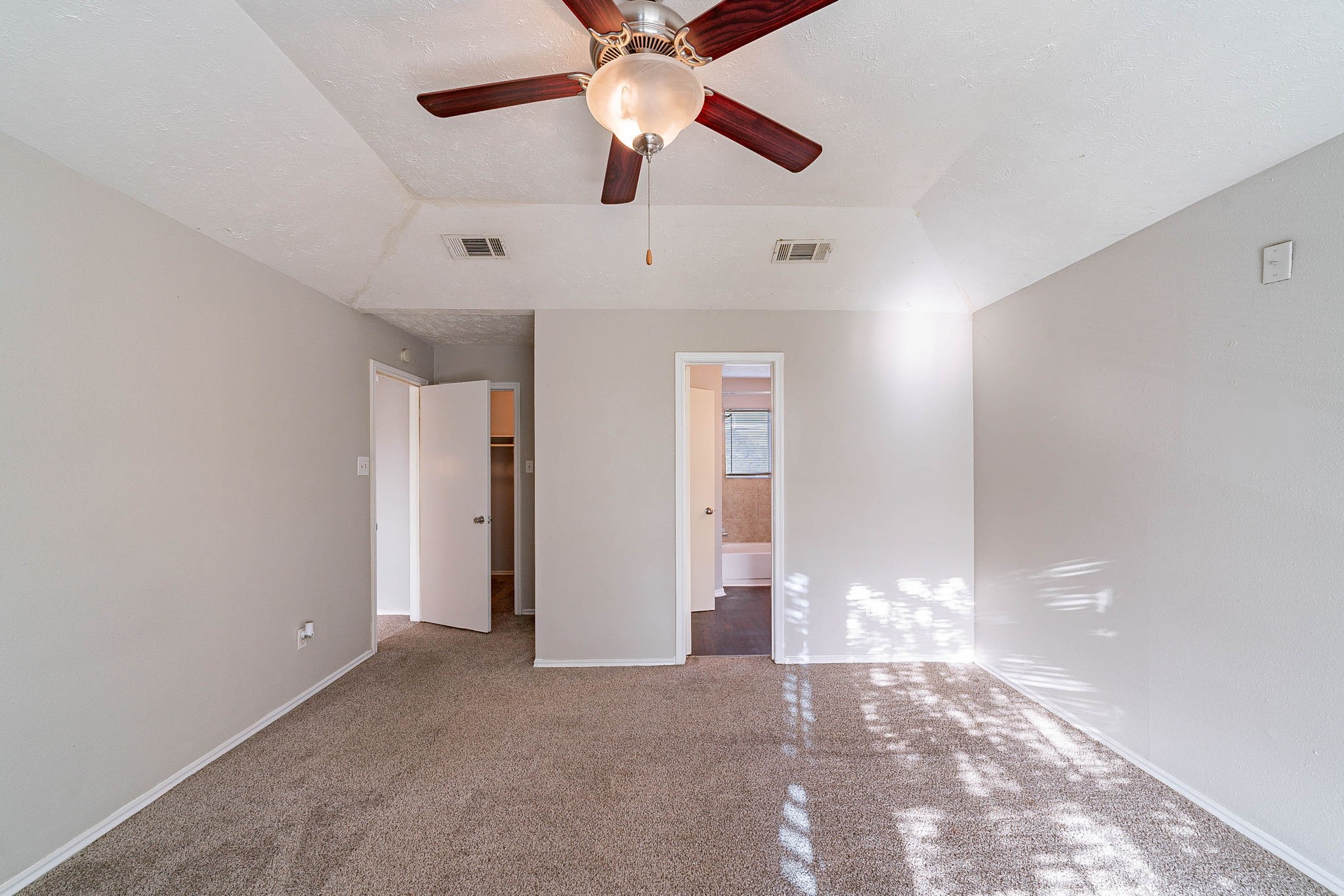1502 Stevenage Lane Channelview, TX 77530 - Photo 18 of 33 a view of an empty room with a ceiling fan