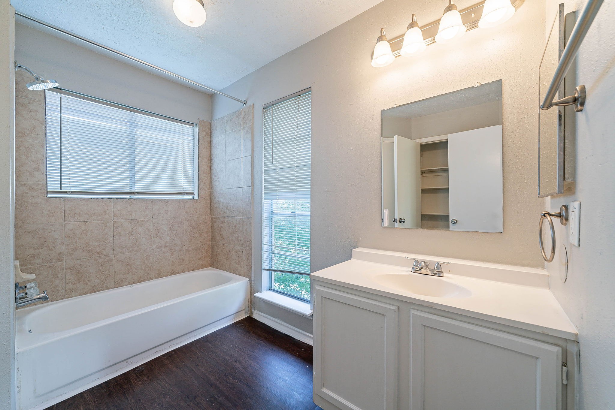 1502 Stevenage Lane Channelview, TX 77530 - Photo 21 of 33 a bathroom with a tub sink and mirror