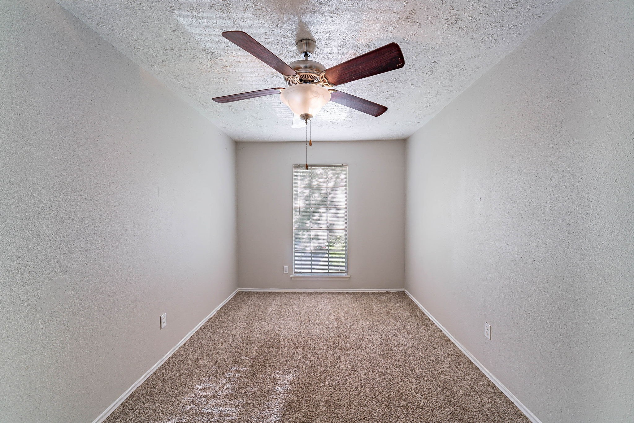 1502 Stevenage Lane Channelview, TX 77530 - Photo 23 of 33 an empty room with ceiling fan and window