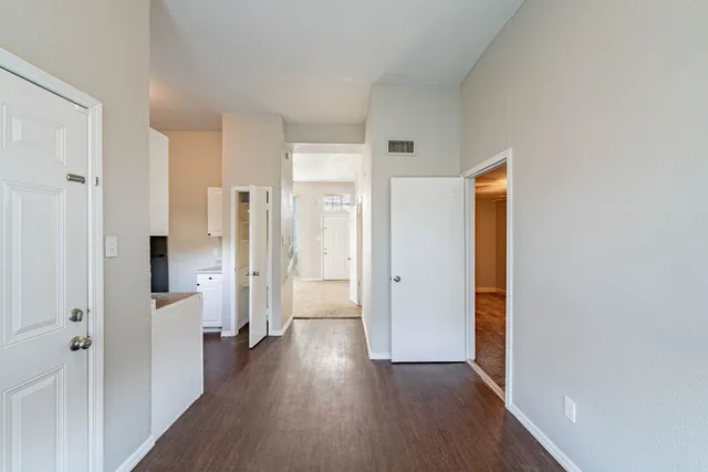 a kitchen with stainless steel appliances granite countertop a sink and cabinets