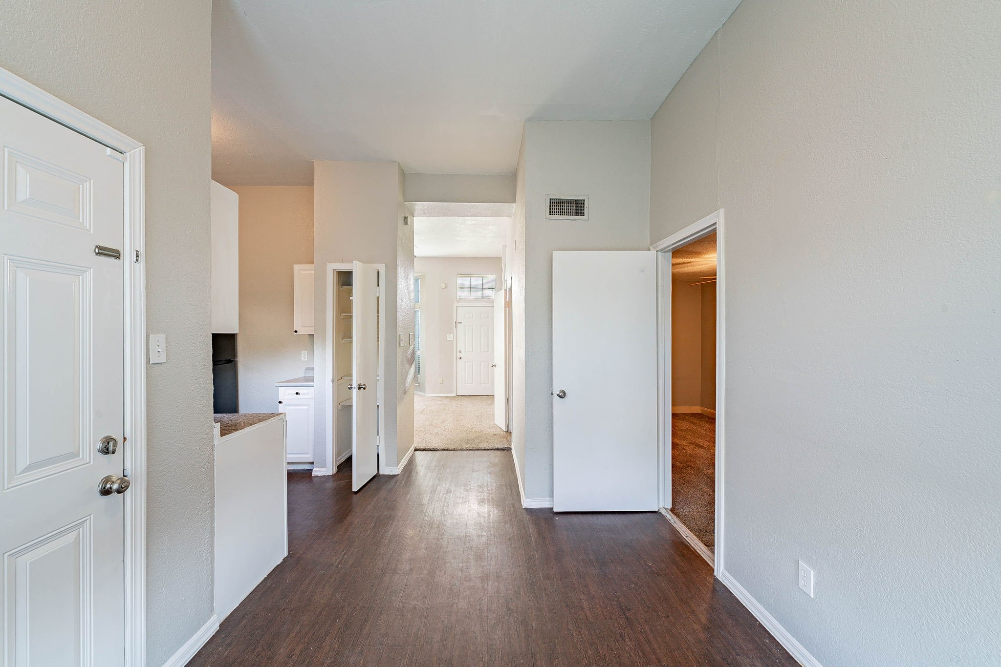 1502 Stevenage Lane Channelview, TX 77530 - Photo 10 of 33 a view of a hallway with wooden floor