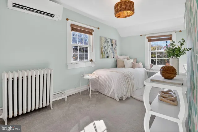 a bedroom with a bed and a window with outer view