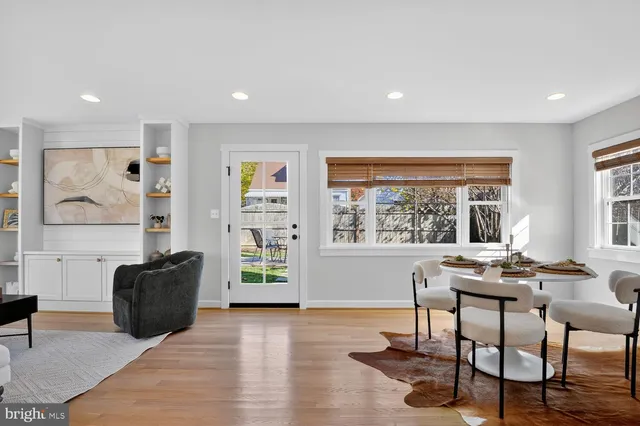 a living room with furniture and large window