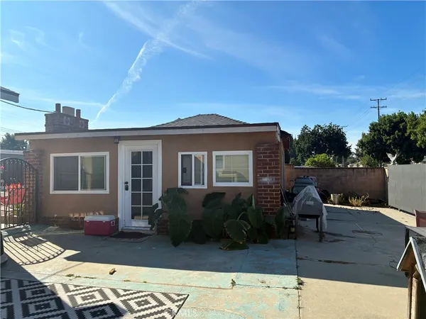 a outdoor space with a table and chairs
