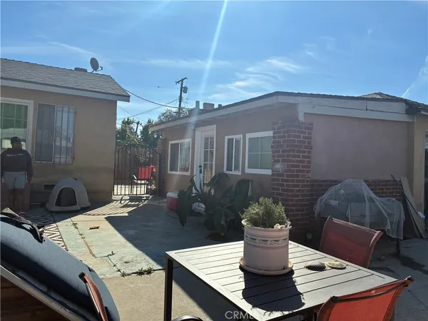 a view of a patio in the backyard