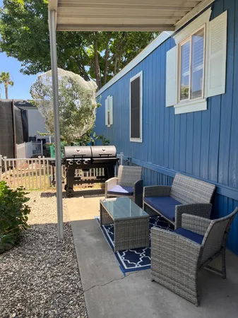 a outdoor space with patio the couches and a dining table with the garden view