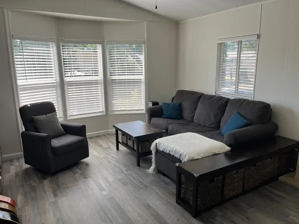 a living room with furniture and windows