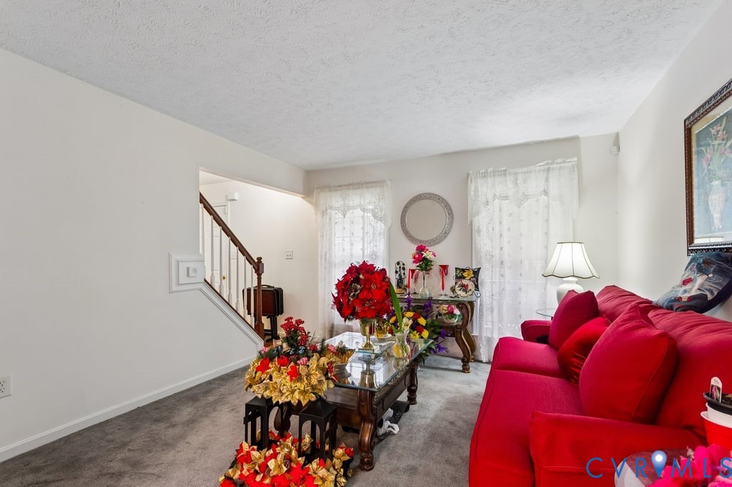 83 Albertson Court Ruther Glen, VA 22546 - Photo 11 of 25 Carpeted living area featuring white walls and a t