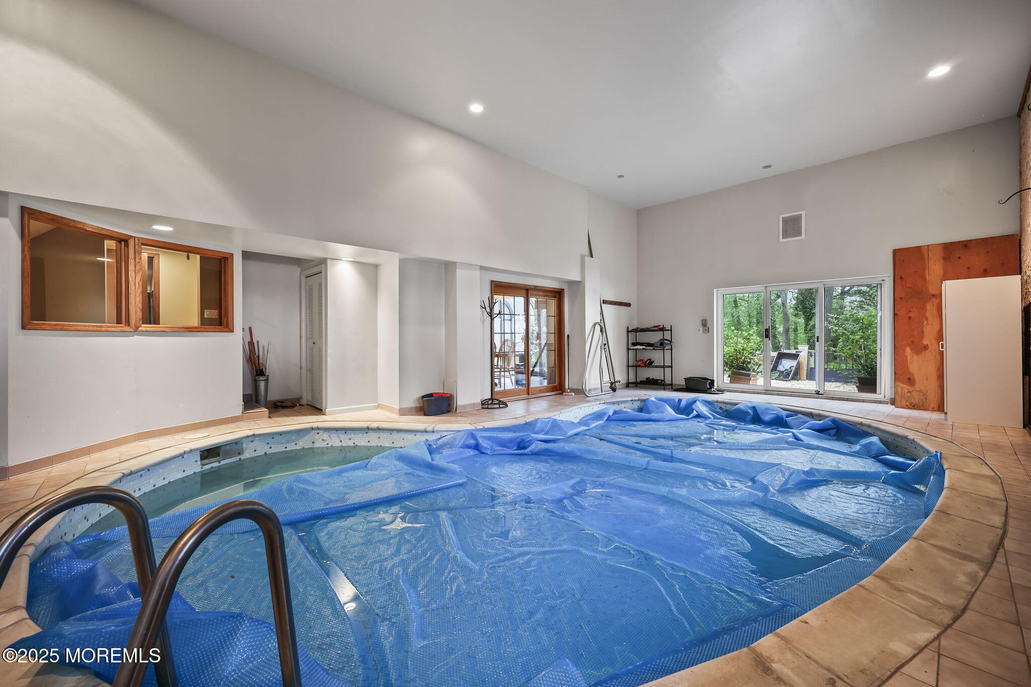 10 West Riverside Drive Brick, NJ 08723 - Photo 17 of 66 a room with bed and large windows