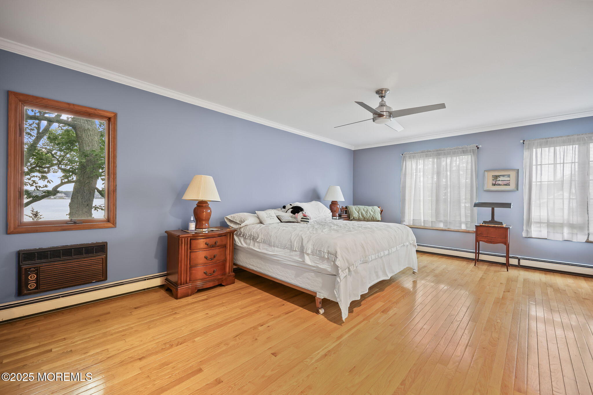 10 West Riverside Drive Brick, NJ 08723 - Photo 20 of 66 a spacious bedroom with a bed and a large window with outer view
