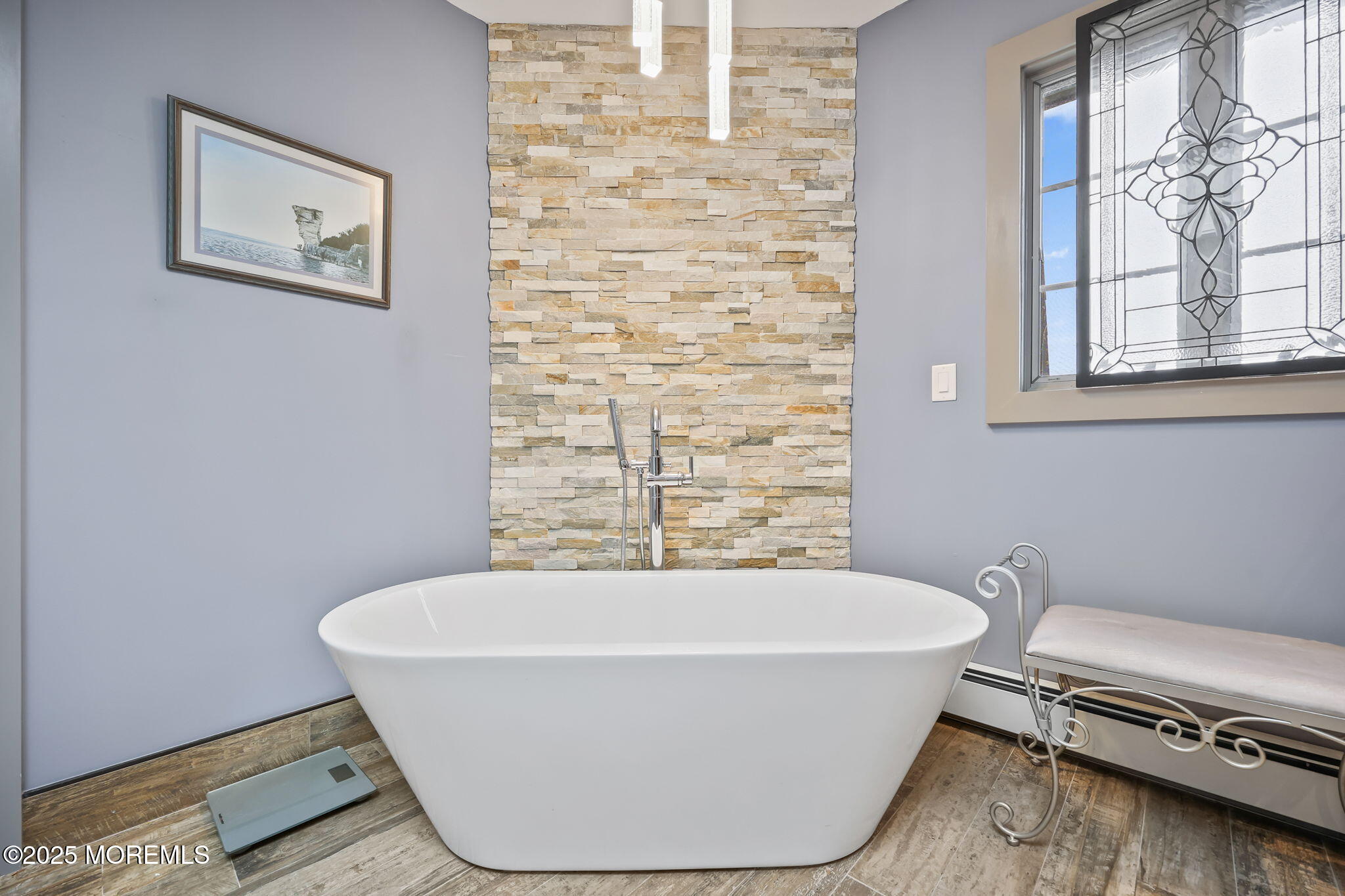 10 West Riverside Drive Brick, NJ 08723 - Photo 23 of 66 a white bath tub sitting in a bathroom next to a window