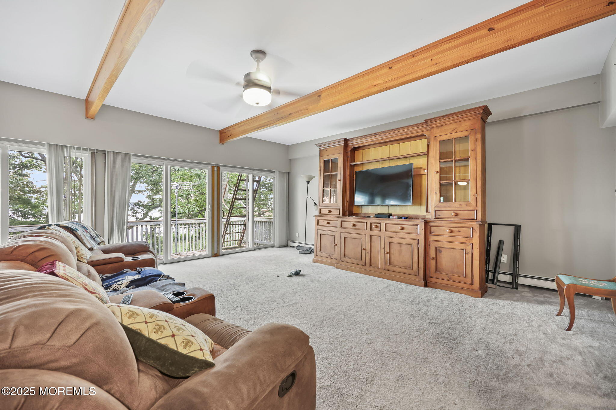 10 West Riverside Drive Brick, NJ 08723 - Photo 33 of 66 a living room with furniture and a flat screen tv
