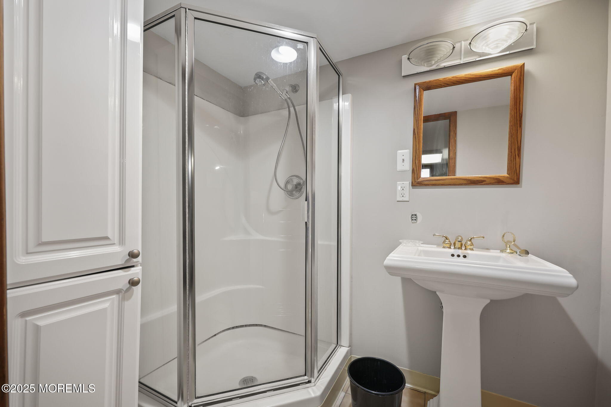 10 West Riverside Drive Brick, NJ 08723 - Photo 44 of 66 a bathroom with a sink mirror and vanity