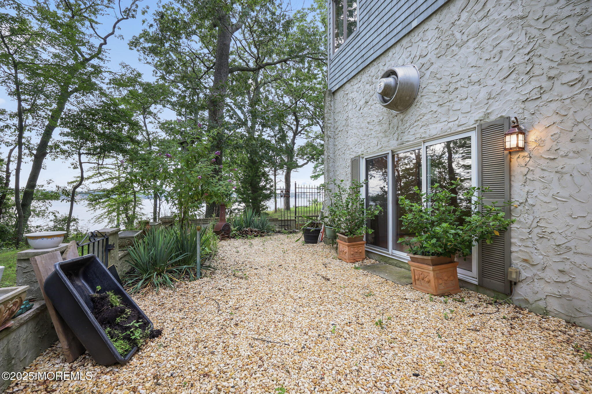 10 West Riverside Drive Brick, NJ 08723 - Photo 45 of 66 a view of a backyard with plants and trees