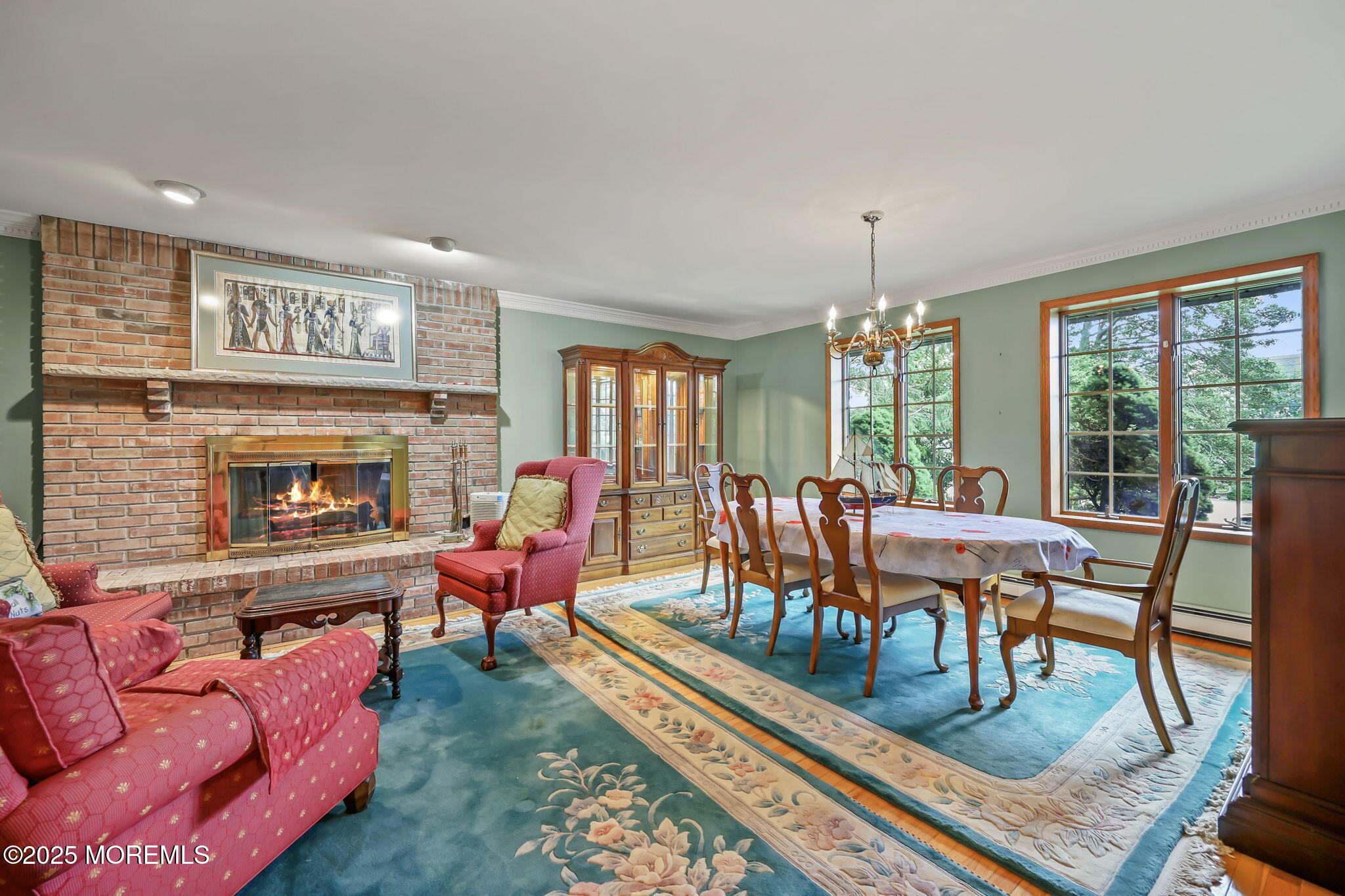 10 West Riverside Drive Brick, NJ 08723 - Photo 5 of 66 a living room with furniture a table and a fireplace