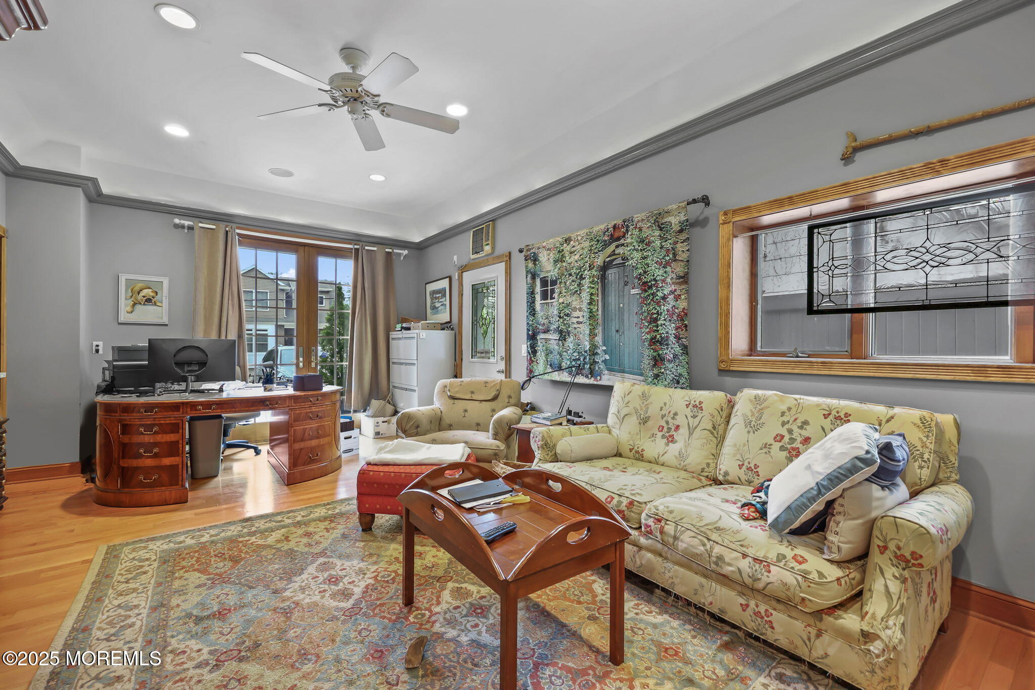 10 West Riverside Drive Brick, NJ 08723 - Photo 8 of 66 a living room with furniture ceiling fan and a rug