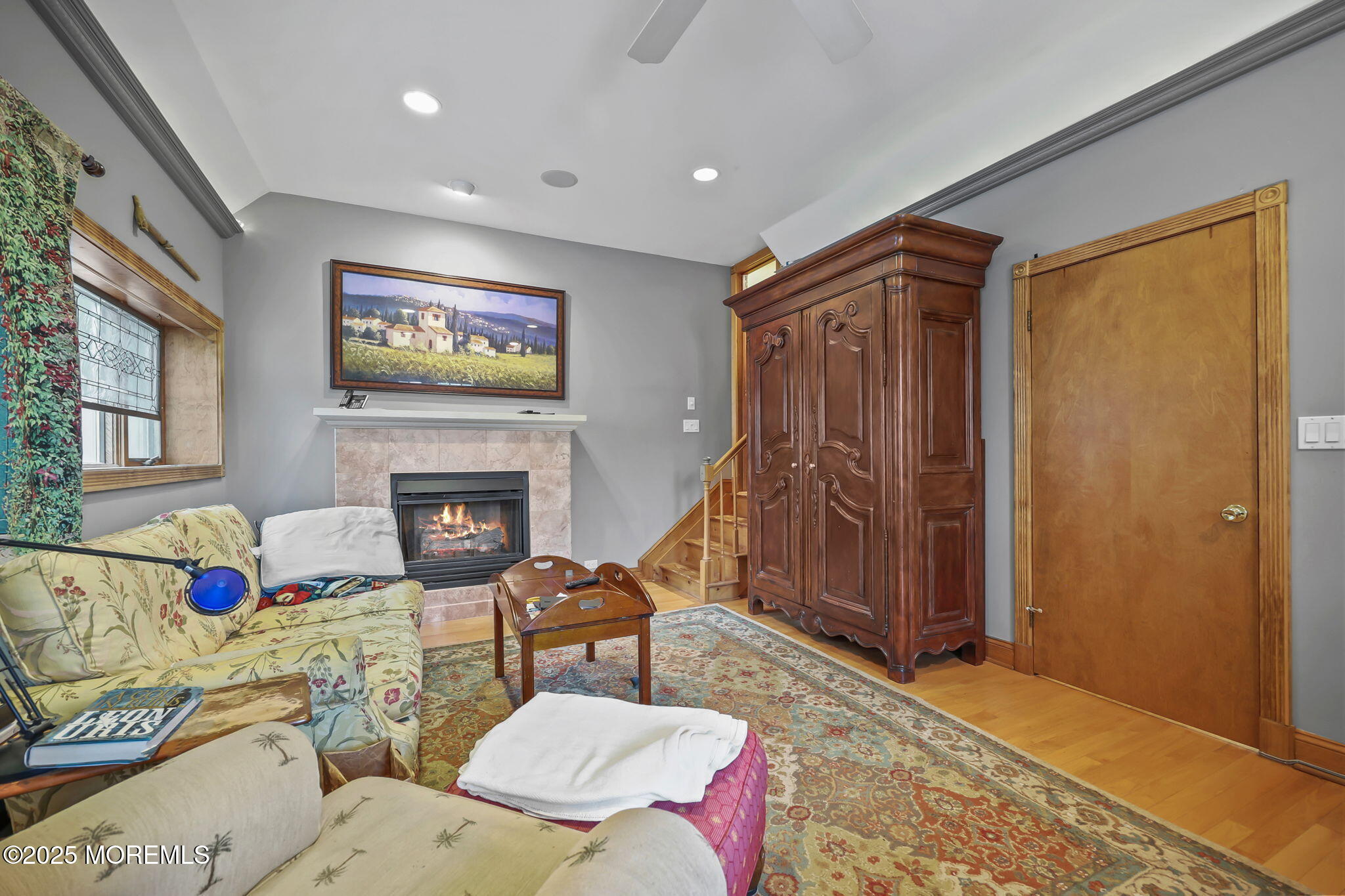 10 West Riverside Drive Brick, NJ 08723 - Photo 9 of 66 a living room with furniture a flat screen tv and a fireplace