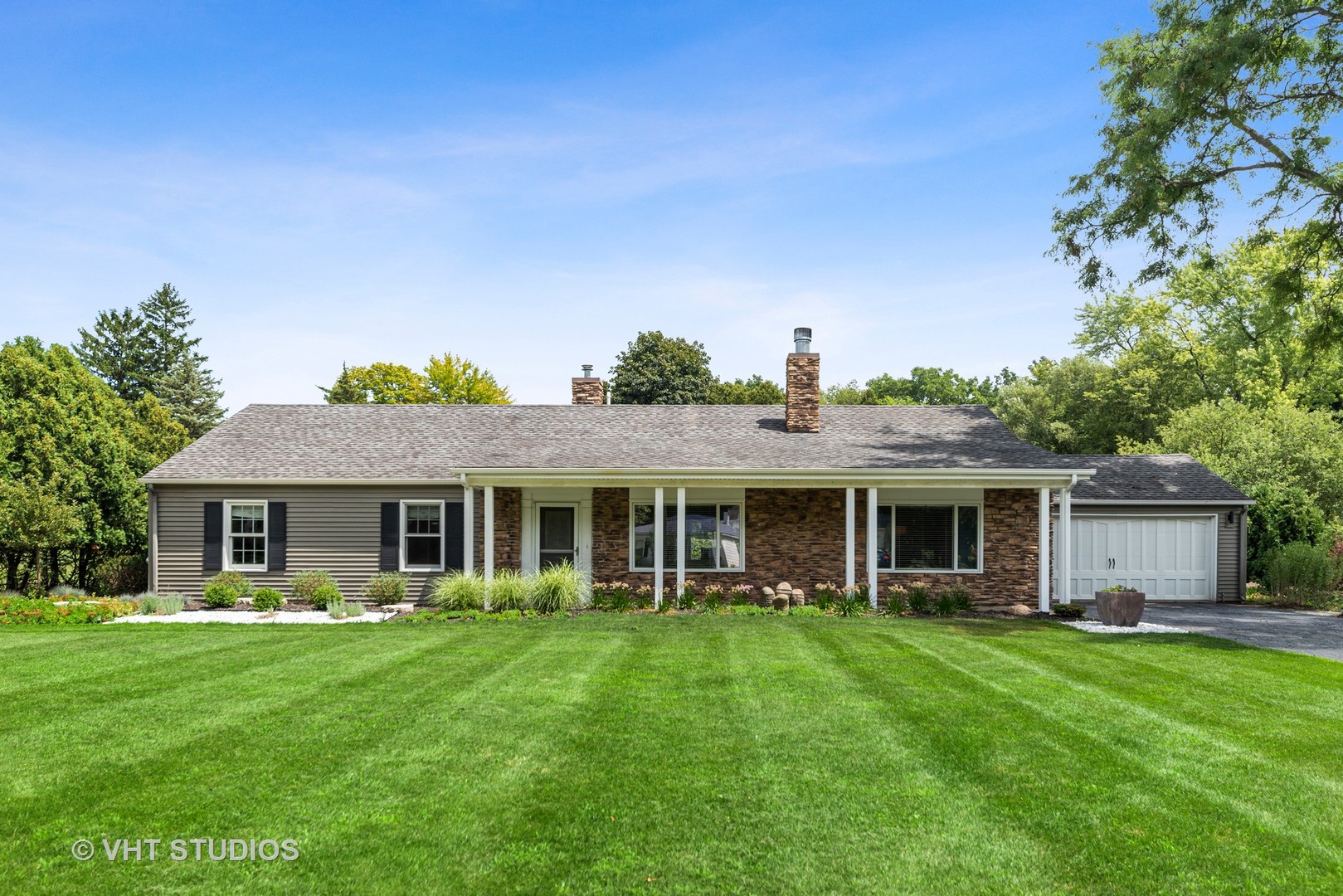 226 Valley Road Trout Valley, IL 60013 - Photo 1 of 32 a front view of the house with yard and green space