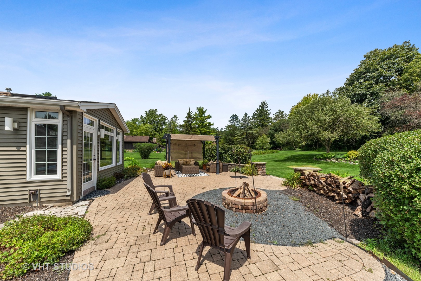 226 Valley Road Trout Valley, IL 60013 - Photo 24 of 32 a view of a patio with a dining table and chairs with a patio
