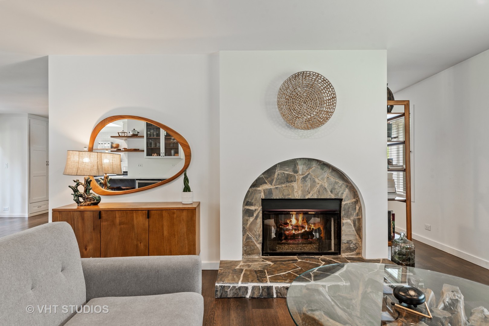 226 Valley Road Trout Valley, IL 60013 - Photo 5 of 32 a living room with furniture a mirror and a fireplace