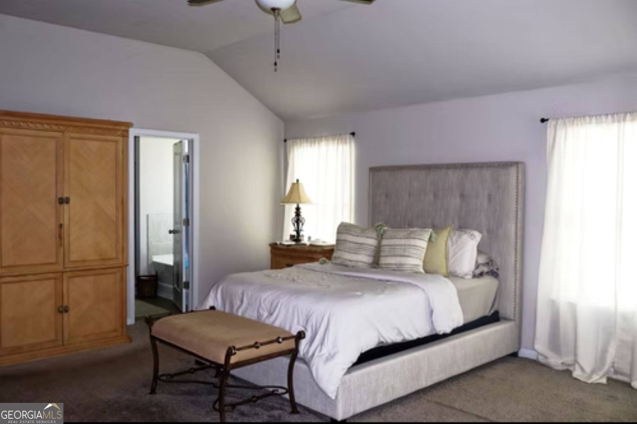 338 Lead Way Jonesboro, GA 30238 - Photo 15 of 17 a bedroom with a bed a rug and a window