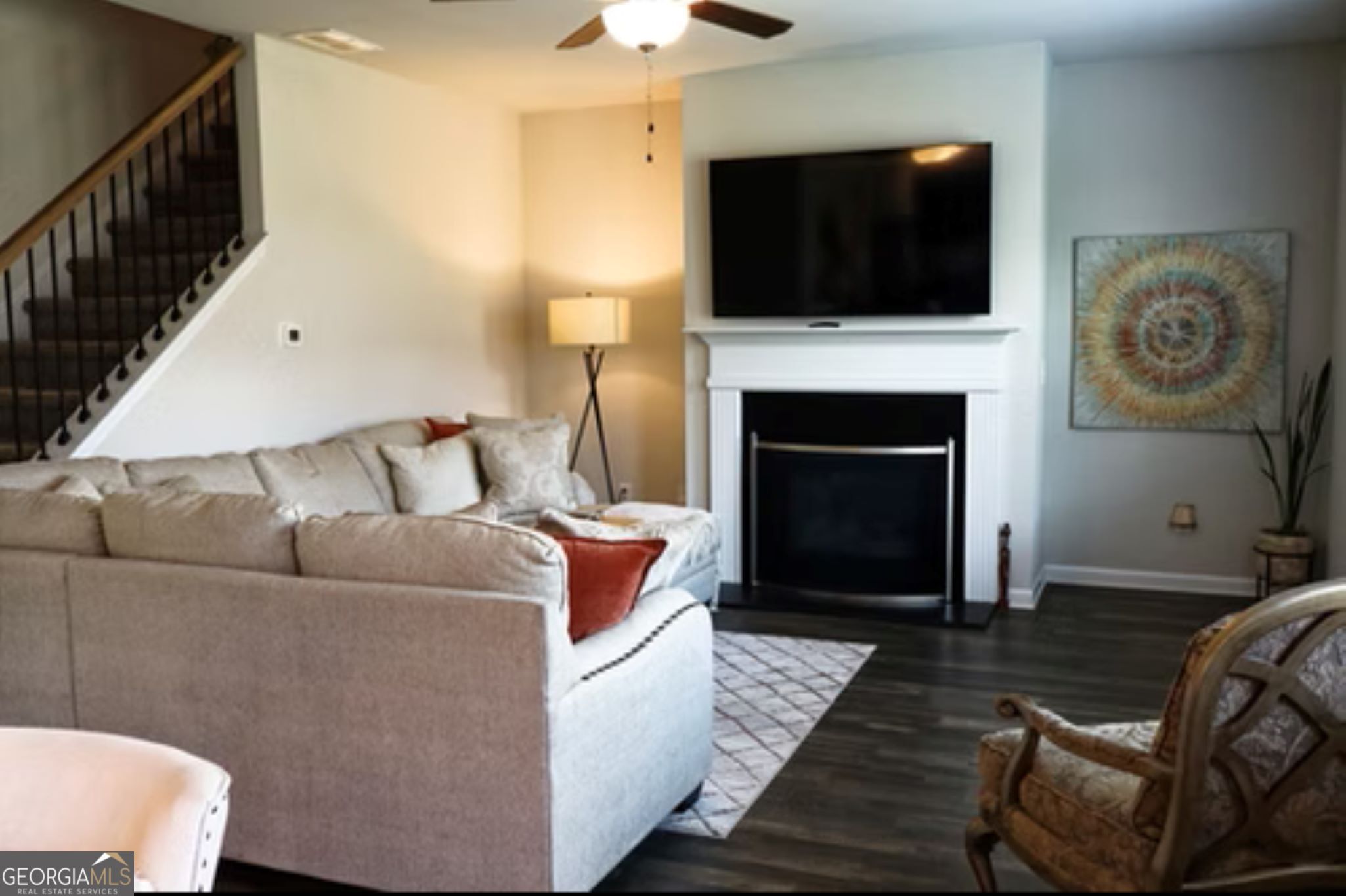 338 Lead Way Jonesboro, GA 30238 - Photo 7 of 17 a living room with furniture a flat screen tv and a fireplace