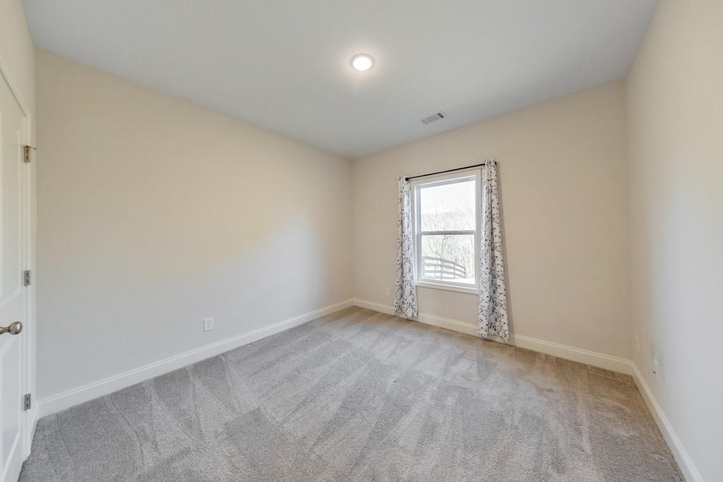 276 Brookstone Trail Dawsonville, GA 30534 - Photo 23 of 44 an empty room with a window