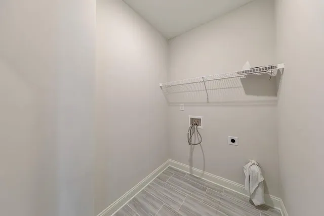 a view of an empty room and bathroom