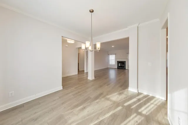 a view of a room with wooden floor and outdoor space