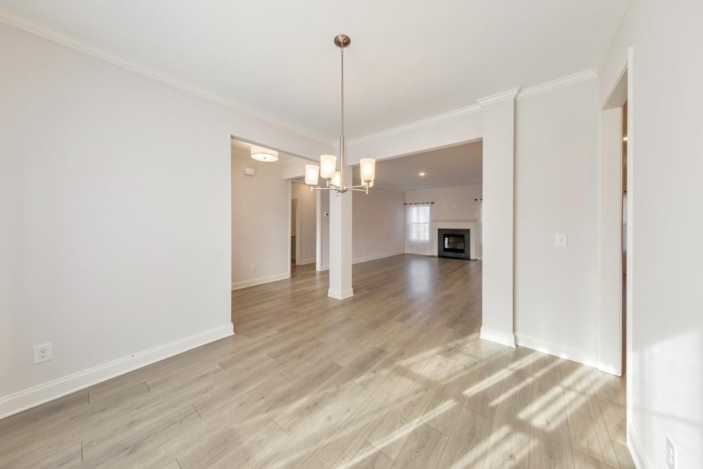 276 Brookstone Trail Dawsonville, GA 30534 - Photo 6 of 44 a view of a room with wooden floor and outdoor space