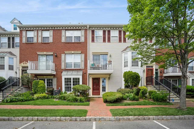 a front view of a building with garden