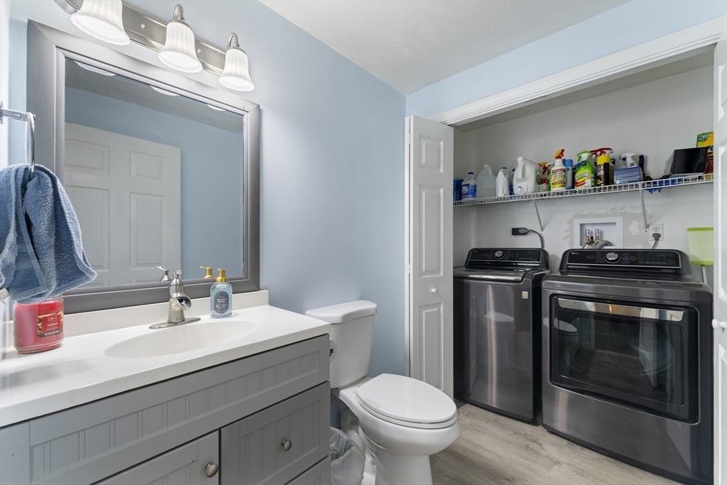 7 Millers Way, Unit C Sutton, MA 01590 - Photo 11 of 28 a bathroom with a sink a toilet and a mirror