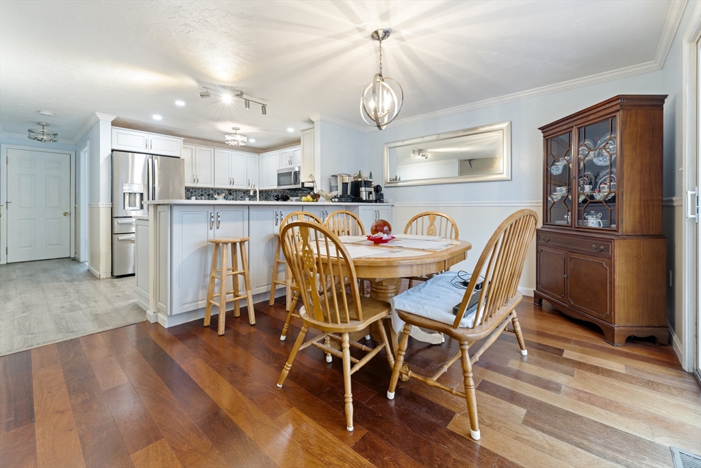 7 Millers Way, Unit C Sutton, MA 01590 - Photo 13 of 28 a view of a dining room with furniture and wooden floor