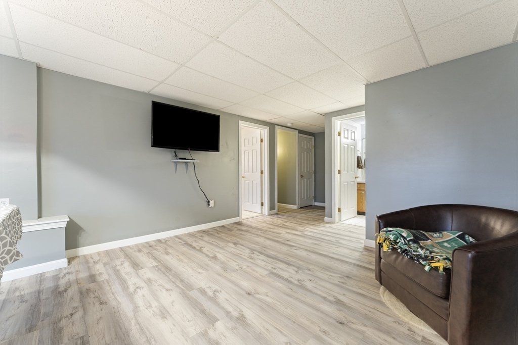 7 Millers Way, Unit C Sutton, MA 01590 - Photo 17 of 28 a bedroom with a bed and a flat screen tv