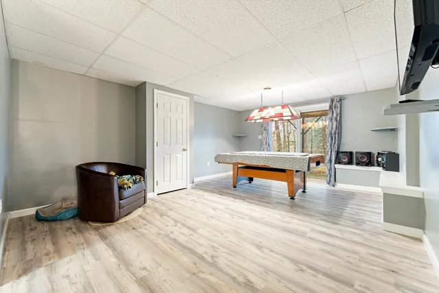 a bedroom with furniture and a chandelier