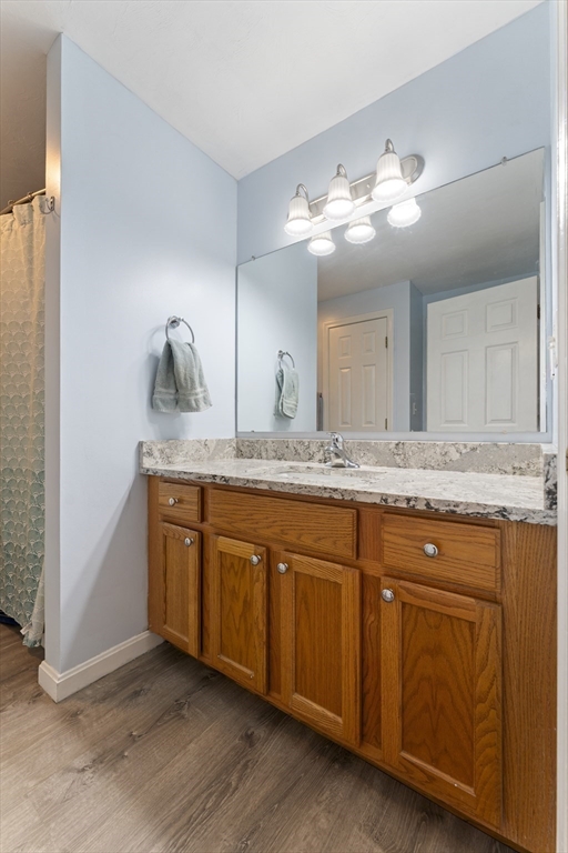 7 Millers Way, Unit C Sutton, MA 01590 - Photo 21 of 28 a bathroom with a granite countertop double vanity sink and mirror