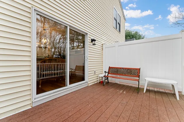a view of a terrace with lounge chair and a floor to ceiling window